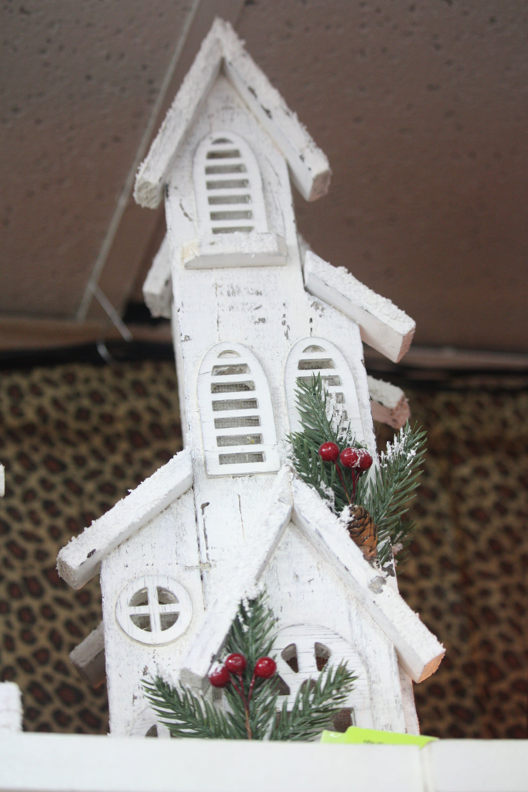 WHITE WOODEN HOUSE WITH GREENERY